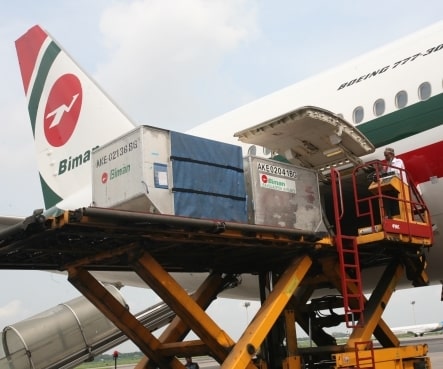 a plane loading cargo on a platform