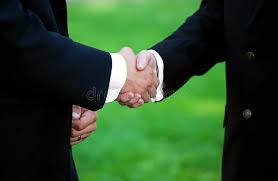 close-up of a man shaking hands