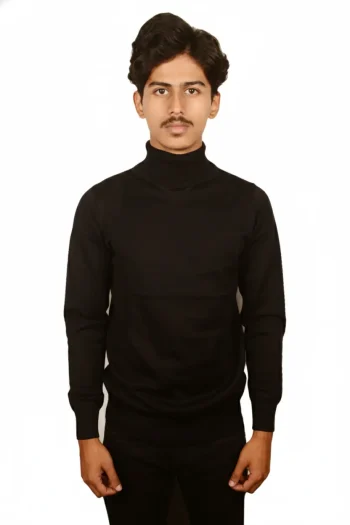 A person stands confidently, wearing a black turtleneck sweater and dark trousers, against a plain white background.
