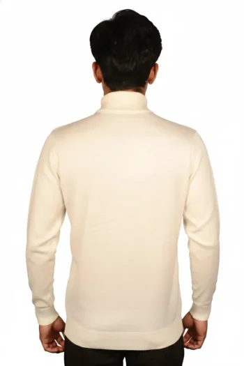 A young man in a cream-colored turtleneck sweater, shown from the back, against a plain white background.