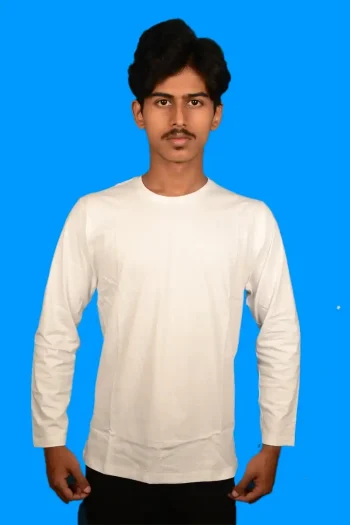 A person wearing a white long-sleeve shirt stands against a bright blue background, hands positioned at their sides.